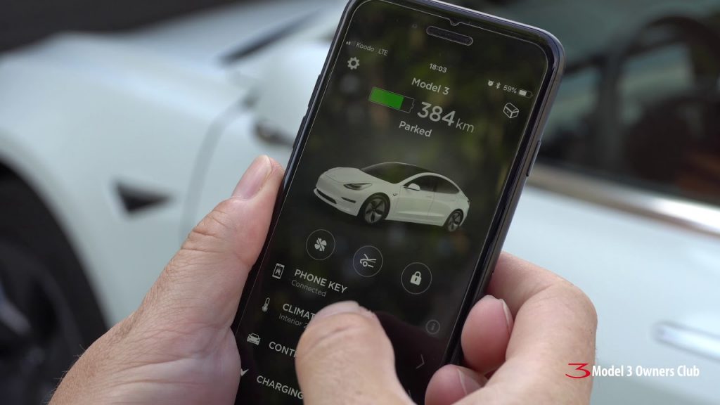 Person using the Tesla Mobile App